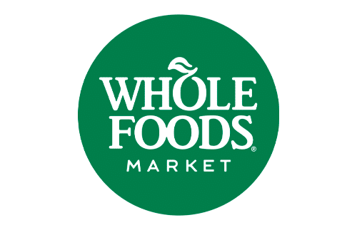 Whole Foods Market logo with white text and a leaf shape above the letter "O," set inside a green circle on a white background.